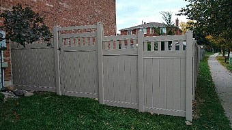 Tan, privacy fence with Vinyl picket top