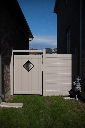 Tan, privacy Gate with metal insert